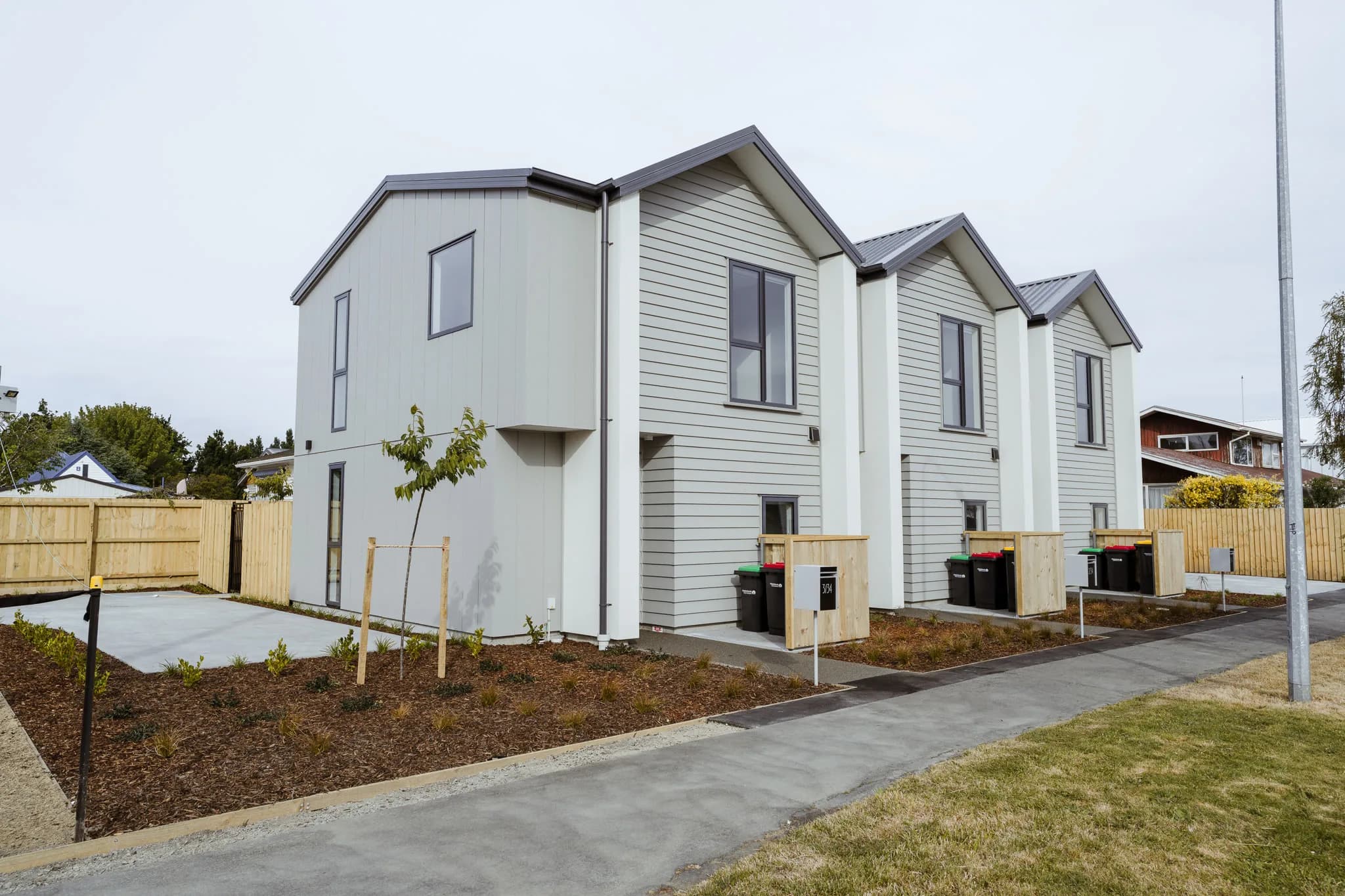 154 Edinburgh Street — white weatherboard townhouses