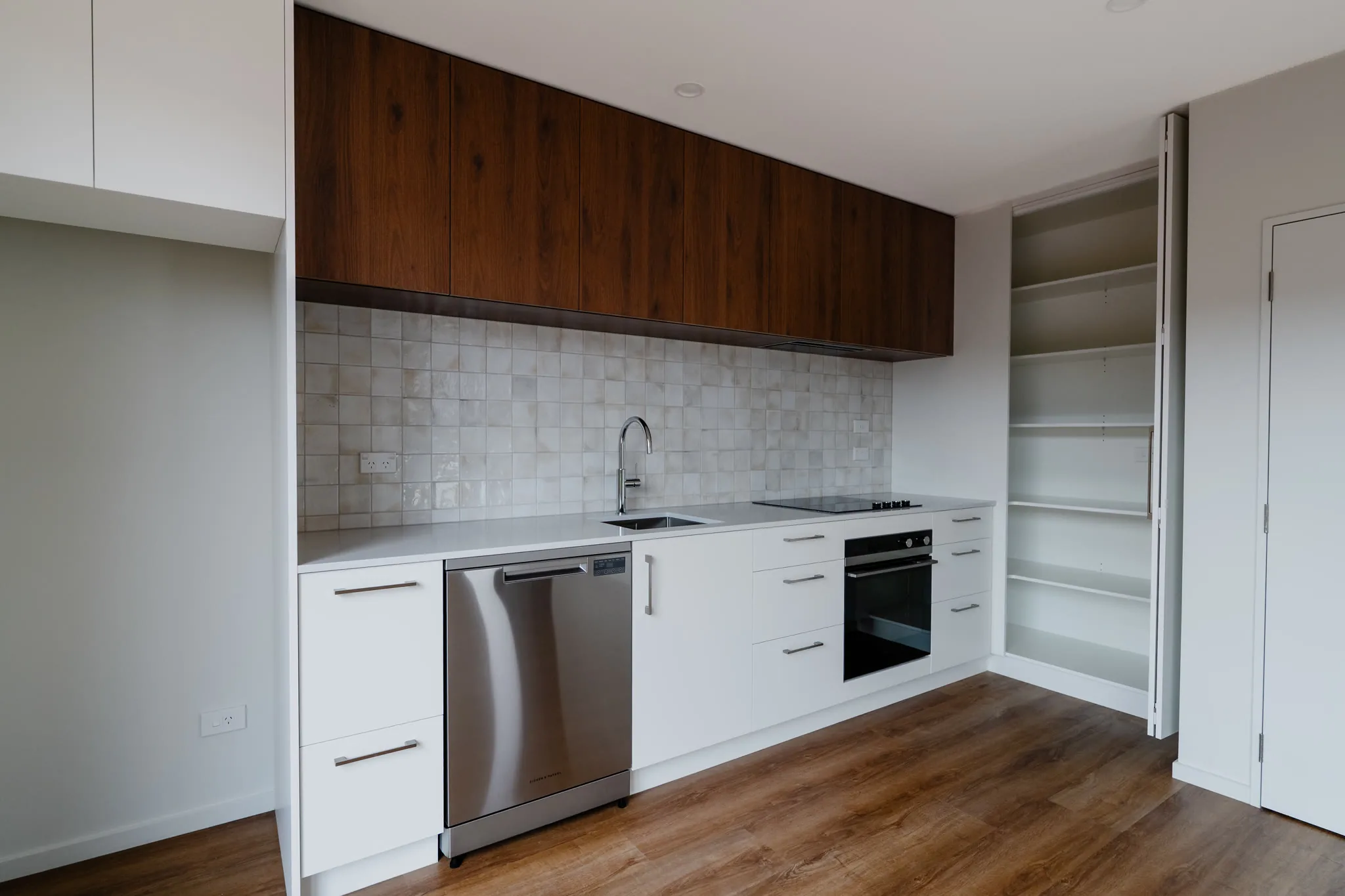Hereford Street — kitchen with Fisher & Paykel appliances and walnut cabinetry