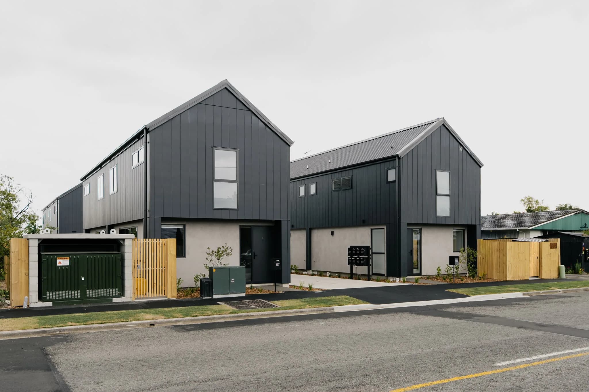 527 Hereford Street — dark-clad townhouses from street