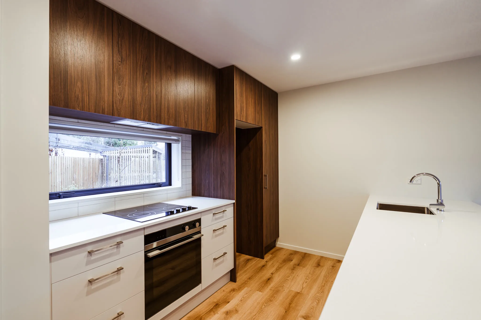 Trist Place — kitchen with walnut uppers and splashback window