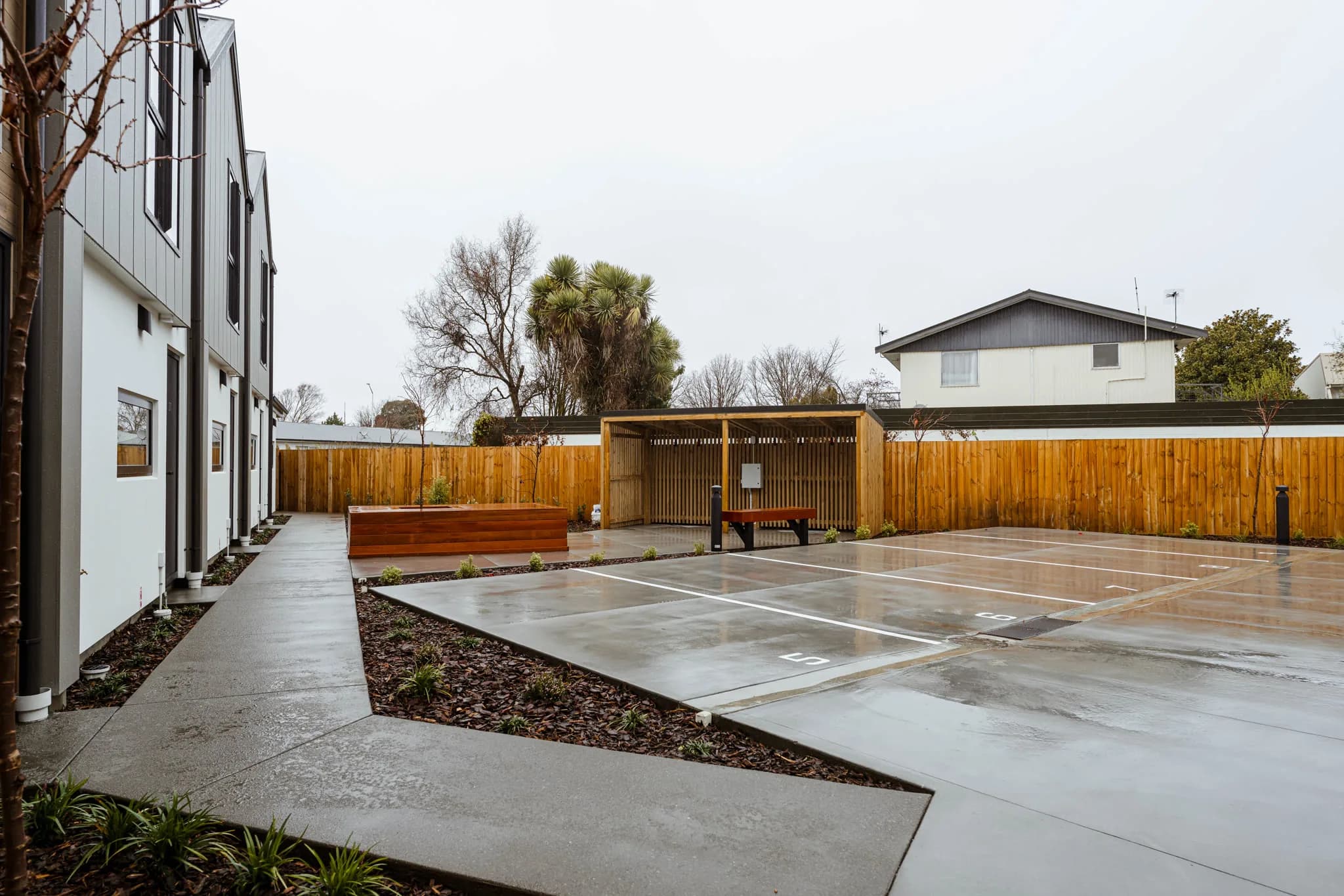 Trist Place — shared parking and landscaped courtyard